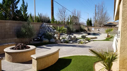 Artificial grass with pool, fire pit and decorative concrete