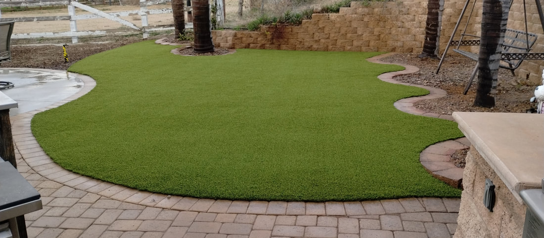 Artificial grass with interlocking pavers